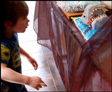  At Piha last weekend they celebrated ten successful years at the gallery  with a bling day and a competition for decorated cakes.  This gruesome shark cake caused a delicious stir of fear   with the children.